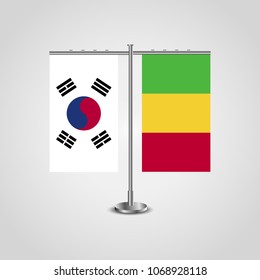 Table stand with flags of South Korea and Mali.Two flag. Flag pole. Symbolizing the cooperation between the two countries. Table flags