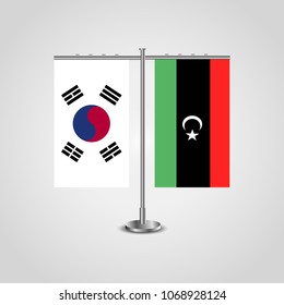 Table stand with flags of South Korea and Libya.Two flag. Flag pole. Symbolizing the cooperation between the two countries. Table flags