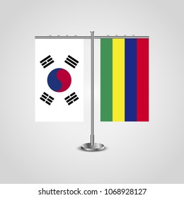 Table stand with flags of South Korea and Mauritius.Two flag. Flag pole. Symbolizing the cooperation between the two countries. Table flags