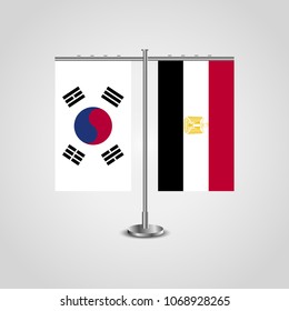 Table stand with flags of South Korea and Egypt.Two flag. Flag pole. Symbolizing the cooperation between the two countries. Table flags