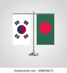 Table stand with flags of South Korea and Bangladesh.Two flag. Flag pole. Symbolizing the cooperation between the two countries. Table flags