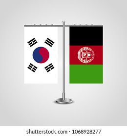 Table stand with flags of South Korea and Afghanistan.Two flag. Flag pole. Symbolizing the cooperation between the two countries. Table flags