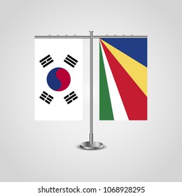 Table stand with flags of South Korea and Seychelles.Two flag. Flag pole. Symbolizing the cooperation between the two countries. Table flags