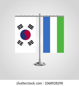 Table stand with flags of South Korea and Sierra Leone.Two flag. Flag pole. Symbolizing the cooperation between the two countries. Table flags