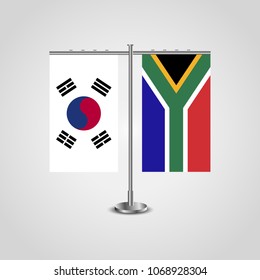Table stand with flags of South Korea and South Africa.Two flag. Flag pole. Symbolizing the cooperation between the two countries. Table flags