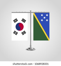 Table stand with flags of South Korea and Solomon islands.Two flag. Flag pole. Symbolizing the cooperation between the two countries. Table flags
