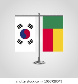 Table stand with flags of South Korea and Benin.Two flag. Flag pole. Symbolizing the cooperation between the two countries. Table flags