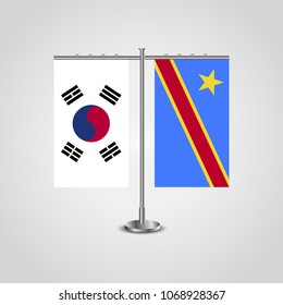 Table stand with flags of South Korea and Democratic Republic of the Congo.Two flag. Flag pole. Symbolizing the cooperation between the two countries. Table flags