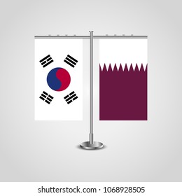 Table stand with flags of South Korea and Qatar.Two flag. Flag pole. Symbolizing the cooperation between the two countries. Table flags