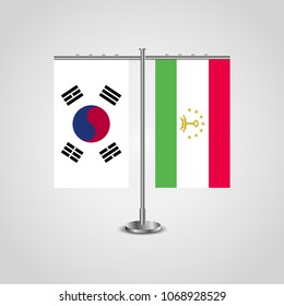 Table stand with flags of South Korea and Tajikistan.Two flag. Flag pole. Symbolizing the cooperation between the two countries. Table flags