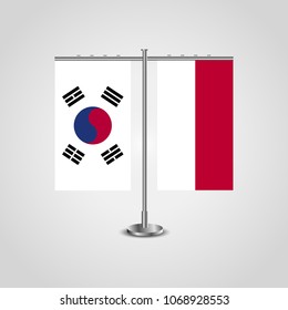 Table stand with flags of South Korea and Indonesia.Two flag. Flag pole. Symbolizing the cooperation between the two countries. Table flags