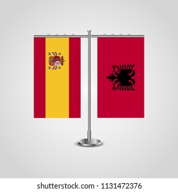 Table stand with flags of Spain and Albania.Two flag. Flag pole. Symbolizing the cooperation between the two countries. Table flags
