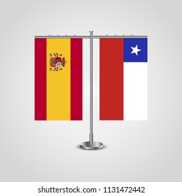 Table stand with flags of Spain and Chile.Two flag. Flag pole. Symbolizing the cooperation between the two countries. Table flags