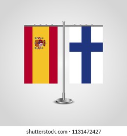 Table stand with flags of Spain and Finland.Two flag. Flag pole. Symbolizing the cooperation between the two countries. Table flags