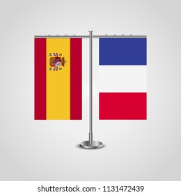 Table stand with flags of Spain and France.Two flag. Flag pole. Symbolizing the cooperation between the two countries. Table flags
