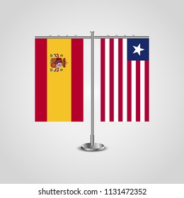 Table stand with flags of Spain and Liberia.Two flag. Flag pole. Symbolizing the cooperation between the two countries. Table flags
