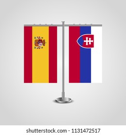 Table stand with flags of Spain and Slovakia.Two flag. Flag pole. Symbolizing the cooperation between the two countries. Table flags