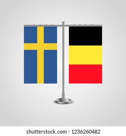 Table stand with flags of Sweden and Belgium.Two flag. Flag pole. Symbolizing the cooperation between the two countries. Table flags