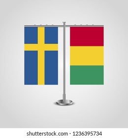 Table stand with flags of Sweden and Guinea.Two flag. Flag pole. Symbolizing the cooperation between the two countries. Table flags