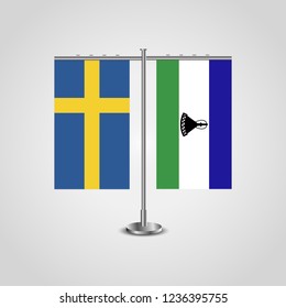 Table stand with flags of Sweden and Lesotho.Two flag. Flag pole. Symbolizing the cooperation between the two countries. Table flags