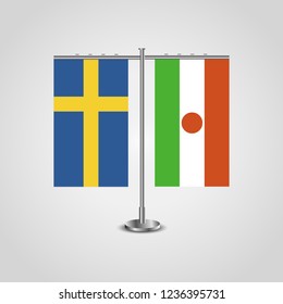 Table stand with flags of Sweden and Niger.Two flag. Flag pole. Symbolizing the cooperation between the two countries. Table flags