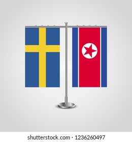 Table stand with flags of Sweden and North Korea.Two flag. Flag pole. Symbolizing the cooperation between the two countries. Table flags

