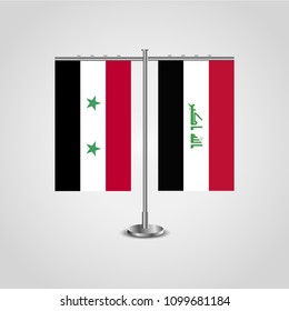 Table stand with flags of Syria and Iraq.Two flag. Flag pole. Symbolizing the cooperation between the two countries. Table flags