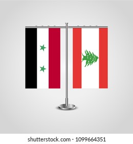Table stand with flags of Syria and Lebanon.Two flag. Flag pole. Symbolizing the cooperation between the two countries. Table flags