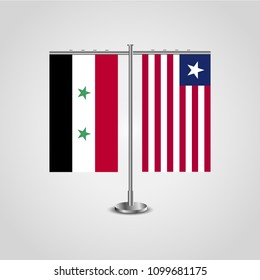 Table stand with flags of Syria and Liberia.Two flag. Flag pole. Symbolizing the cooperation between the two countries. Table flags