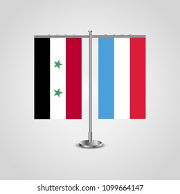 Table stand with flags of Syria and Luxembourg.Two flag. Flag pole. Symbolizing the cooperation between the two countries. Table flags