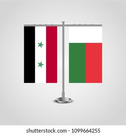 Table stand with flags of Syria and Madagascar.Two flag. Flag pole. Symbolizing the cooperation between the two countries. Table flags