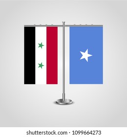 Table stand with flags of Syria and Somalia.Two flag. Flag pole. Symbolizing the cooperation between the two countries. Table flags