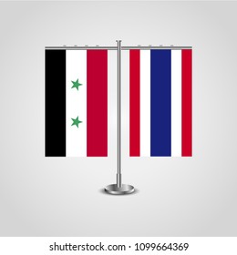 Table stand with flags of Syria and Thailand.Two flag. Flag pole. Symbolizing the cooperation between the two countries. Table flags