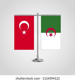 Table stand with flags of Turkey and Algeria.Two flag. Flag pole. Symbolizing the cooperation between the two countries. Table flags