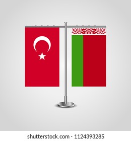 Table stand with flags of Turkey and Belarus.Two flag. Flag pole. Symbolizing the cooperation between the two countries. Table flags