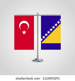 Table stand with flags of Turkey and Bosnia and Herzegovina.Two flag. Flag pole. Symbolizing the cooperation between the two countries. Table flags