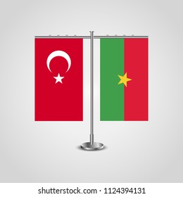 Table stand with flags of Turkey and Burkina Faso.Two flag. Flag pole. Symbolizing the cooperation between the two countries. Table flags