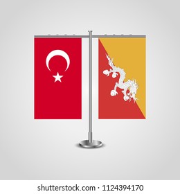 Table stand with flags of Turkey and Butane.Two flag. Flag pole. Symbolizing the cooperation between the two countries. Table flags