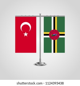 Table stand with flags of Turkey and Dominica.Two flag. Flag pole. Symbolizing the cooperation between the two countries. Table flags