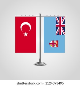 Table stand with flags of Turkey and Fiji.Two flag. Flag pole. Symbolizing the cooperation between the two countries. Table flags