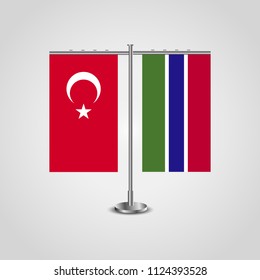 Table stand with flags of Turkey and Gambia.Two flag. Flag pole. Symbolizing the cooperation between the two countries. Table flags