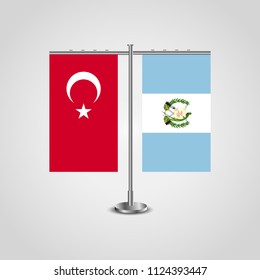 Table stand with flags of Turkey and Guatemala.Two flag. Flag pole. Symbolizing the cooperation between the two countries. Table flags