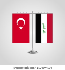 Table stand with flags of Turkey and Iraq.Two flag. Flag pole. Symbolizing the cooperation between the two countries. Table flags