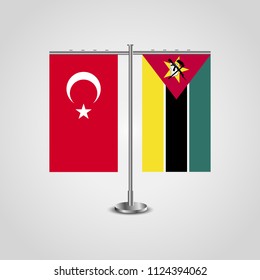 Table stand with flags of Turkey and Mozambique.Two flag. Flag pole. Symbolizing the cooperation between the two countries. Table flags