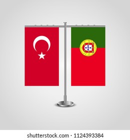 Table stand with flags of Turkey and Portugal.Two flag. Flag pole. Symbolizing the cooperation between the two countries. Table flags