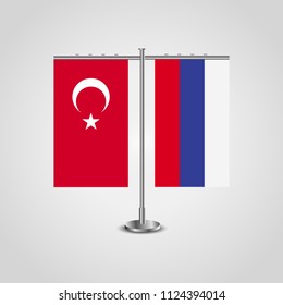 Table stand with flags of Turkey and Russia.Two flag. Flag pole. Symbolizing the cooperation between the two countries. Table flags