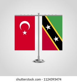 Table stand with flags of Turkey and Saint Kitts and Nevis.Two flag. Flag pole. Symbolizing the cooperation between the two countries. Table flags