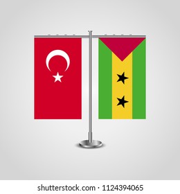 Table stand with flags of Turkey and Sao Tome and Principe.Two flag. Flag pole. Symbolizing the cooperation between the two countries. Table flags