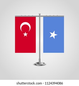 Table stand with flags of Turkey and Somalia.Two flag. Flag pole. Symbolizing the cooperation between the two countries. Table flags