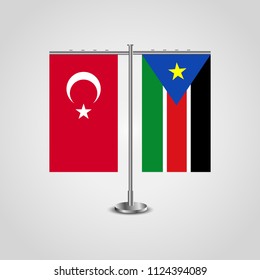 Table stand with flags of Turkey and Southern Sudan.Two flag. Flag pole. Symbolizing the cooperation between the two countries. Table flags
